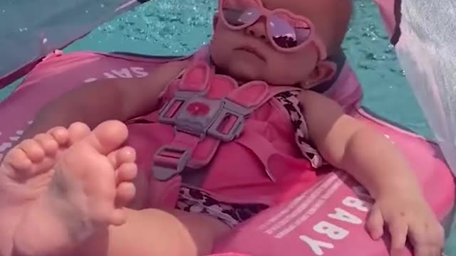 Baby enjoying the pool