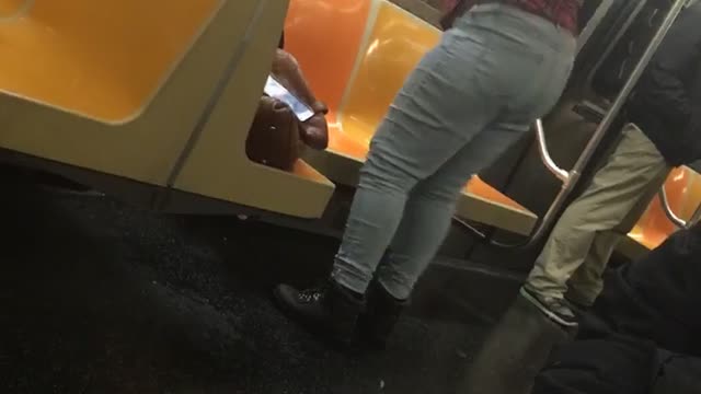 Woman red shirt dancing in subway