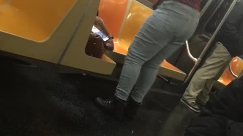 Woman red shirt dancing in subway