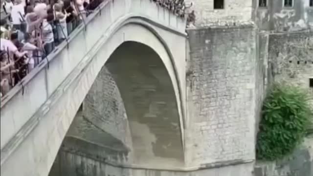 Man jumping off the bridge