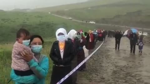 Tibet People Line Up In The Rain For A Daily Covid Test