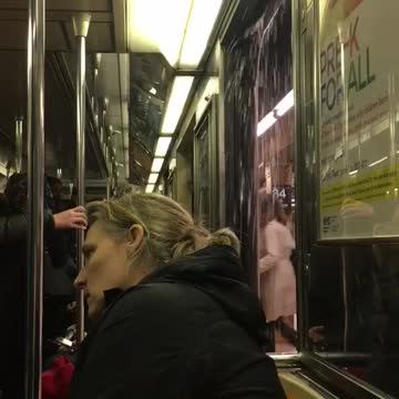 People stare at open subway door water pouring in