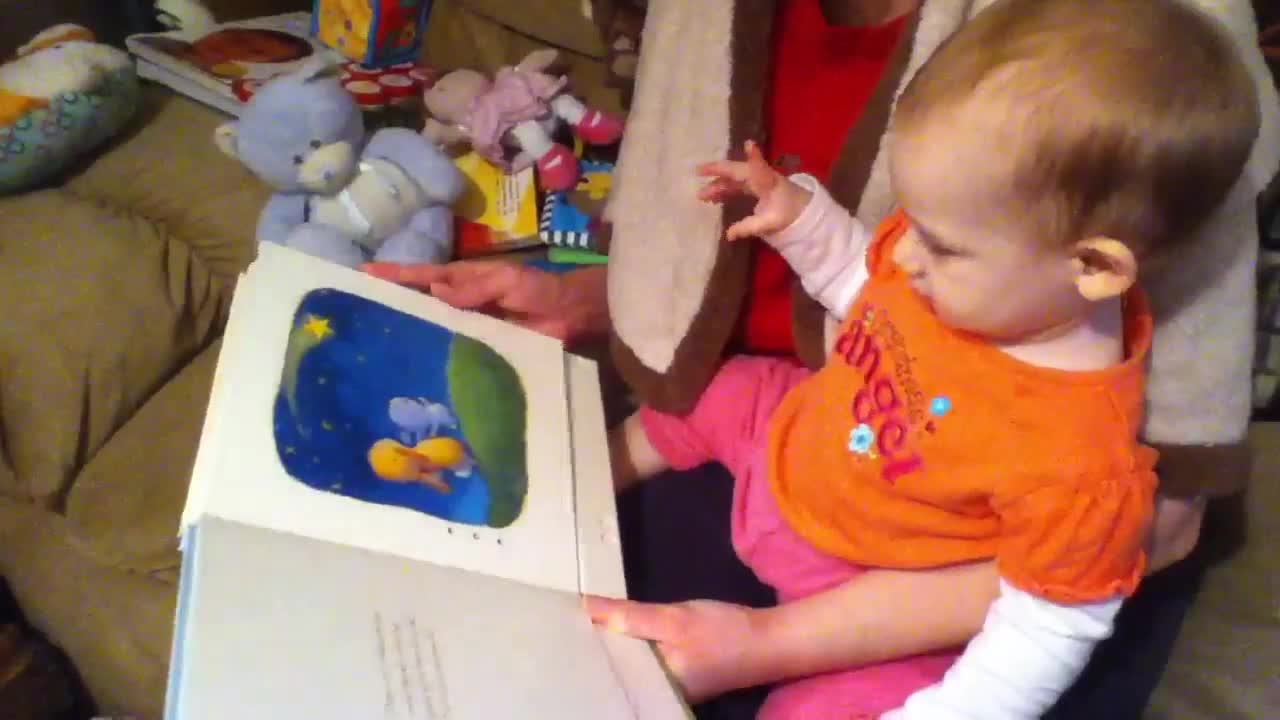 Emma being read to