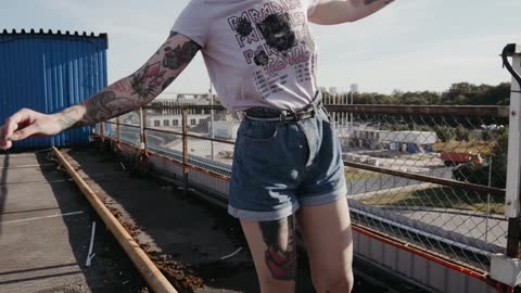 video woman walking on the railing