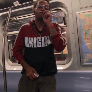 Nsfw man in red jacket smoking on subway