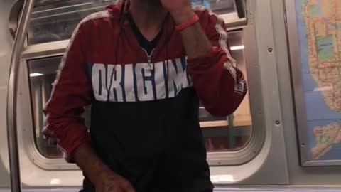 Nsfw man in red jacket smoking on subway