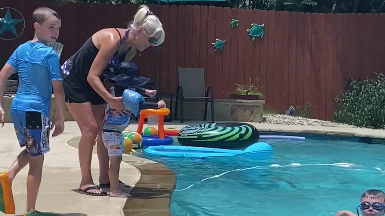 MareBear helping our youngest grandson overcome his fear of jumping into the pool.