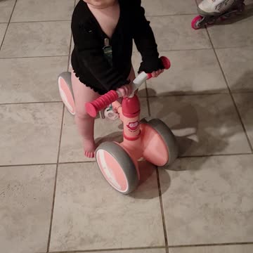 Baby riding her bike