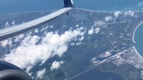 Atlas V Launch captured from a plane flying by Cape Caneveral