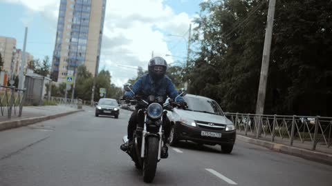 Boy bike riding in streets early morning