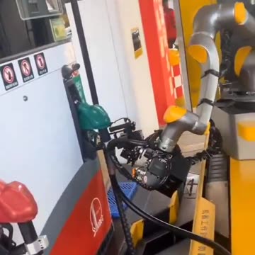 Hangzouh, China - An A.I Robot refuels your car.