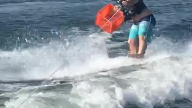 Long distance wake board beer throw to orange basket