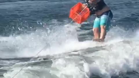 Long distance wake board beer throw to orange basket