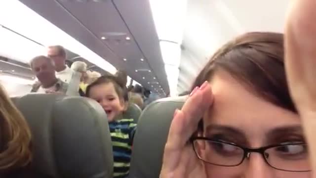 Laughing Baby on Airplane -- So Cute!!