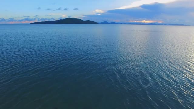 flight above the sea aerial view of the ocean in thailand hi speed motion