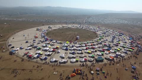 Aerial drone shot of naadam festival mongolia dozen of yurts sunny day