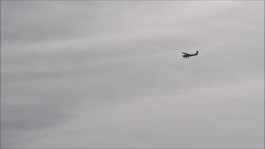 Zoom-in to a Small Plane Over Grunthal Manitoba