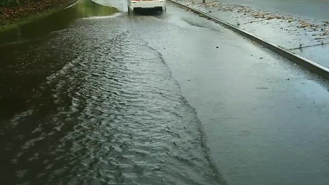 Flooded Road just after heavy rain Swindon England UK 31st October 2021