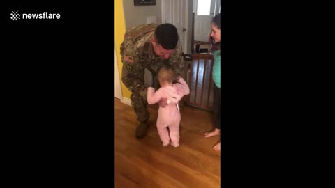 Toddler erupts into laughter as military dad's return home