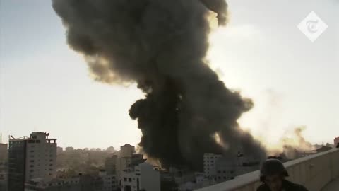 Journalist rushes for cover as Gaza building destroyed during live.