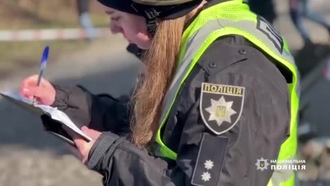 Police are documenting the aftermath of the morning Russian shelling of Kyiv