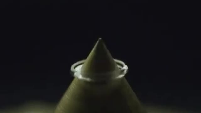 This drop of water falling on a sharp object