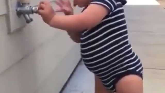 The girl is trying to open something try to laugh