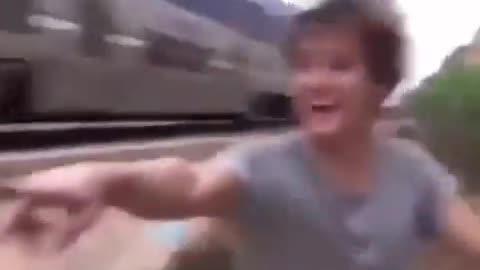 Skaters Inches From Train