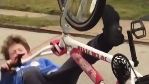 Blue sweater back wheel bike fall
