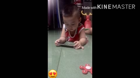 the boy was playing with the lovely phone