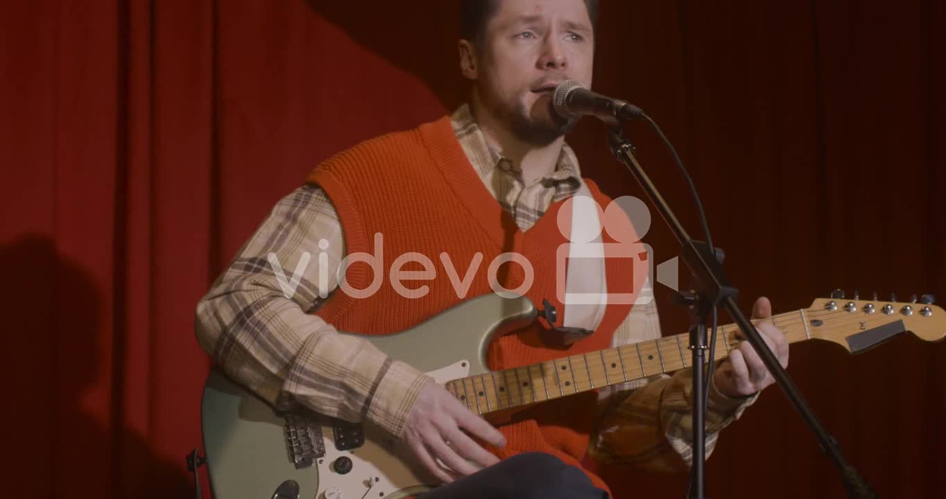 Male Musician Playing Guitar And Singing During Live Music Perfomance 2