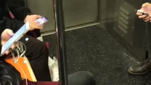 Person playing mobile phone game bejeweled subway