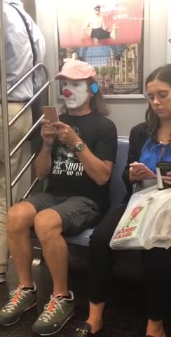 Man clown make up red hat