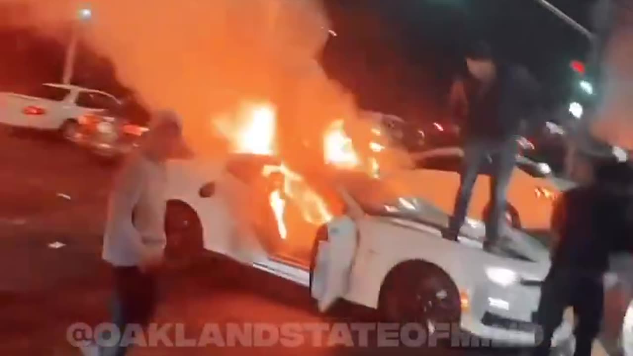 5G zombie muslims and blacks are pyromaniacs burning down cars in Oakland California