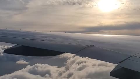 A beautiful sky seen through the window of an airplane