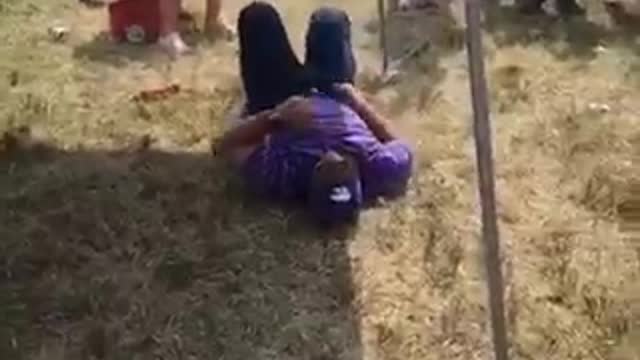 Drunk guy purple stripe shirt backflip off back of pick up truck
