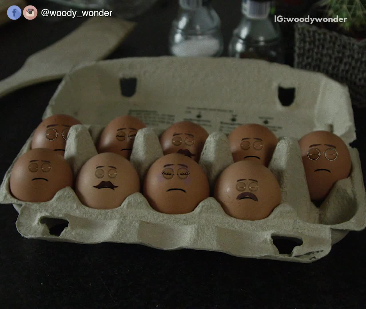 Man making eggs with faces on them