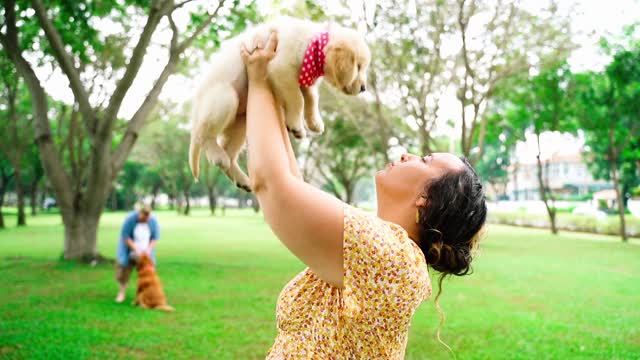 Video of a Puppy Licking a Woman