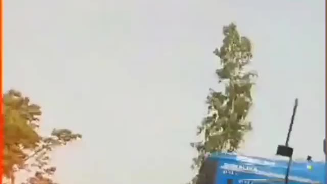 Funny tractor driver flying with his tractor