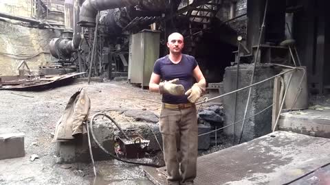 Man Puts Hand In Molten Metal