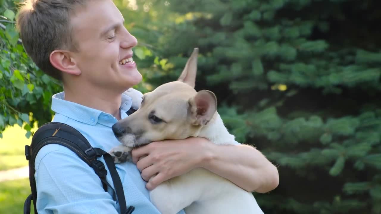 The dog loves the owner kisses and licks it