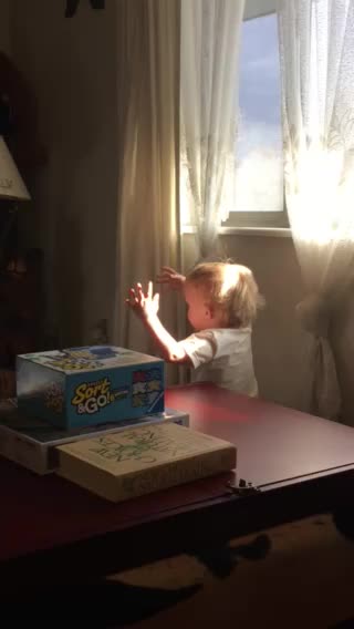 Grandson catching the sun rays.