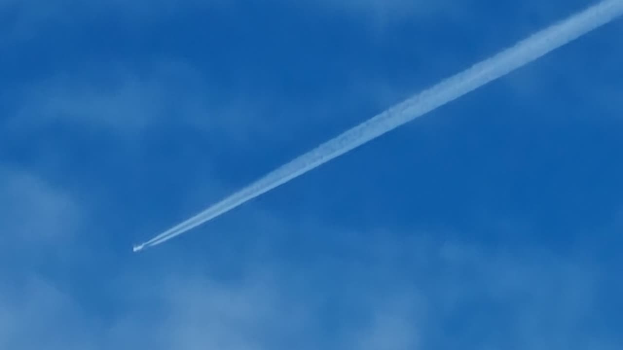 Contrail In Sky Above North Wales.