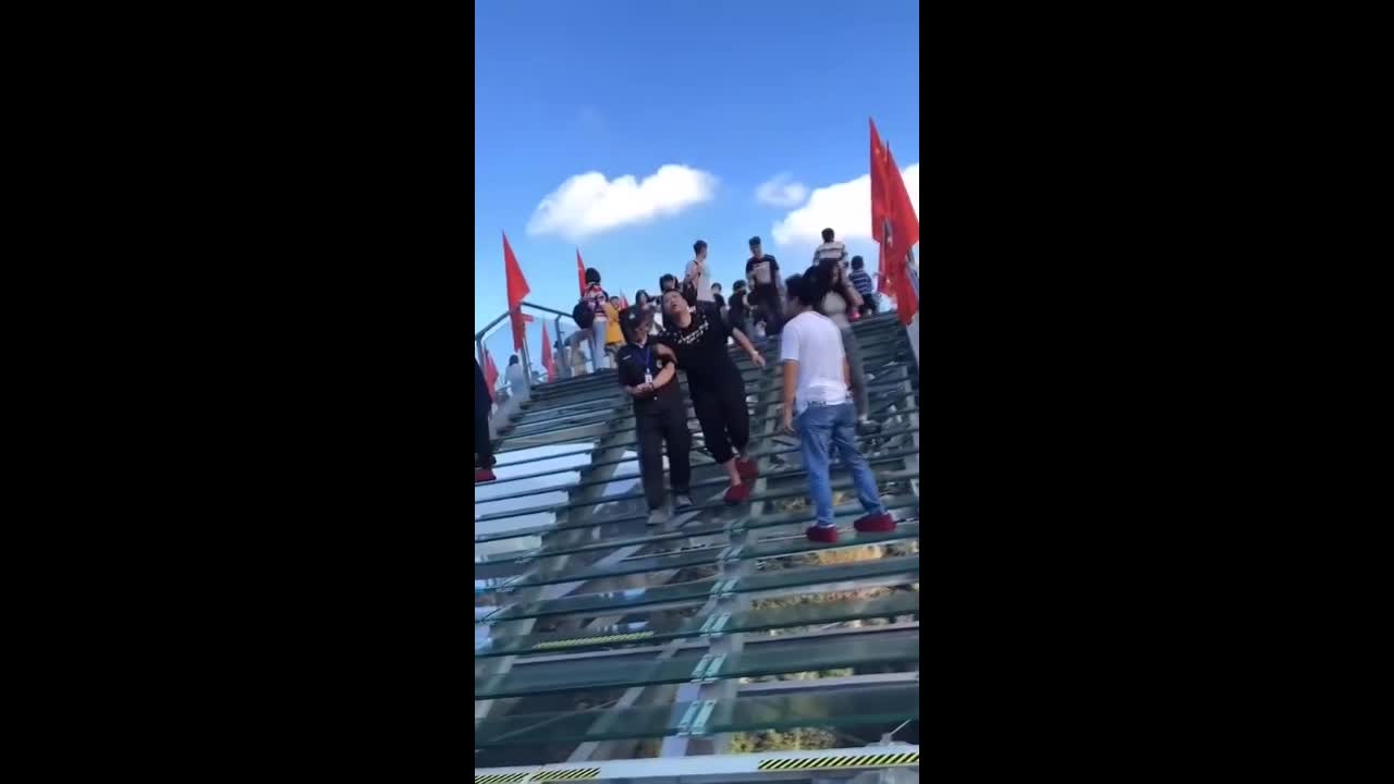 Viral: Scared Tourist Helped Off Glass Observation Deck