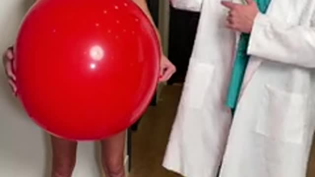 doctor pops nurse's balloon for surprise