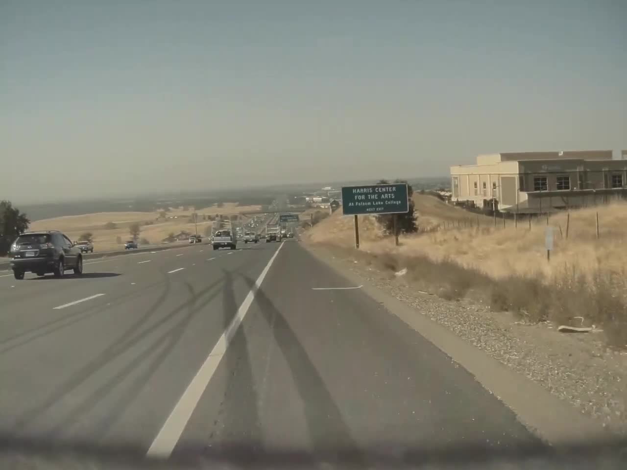 Unsecured Ladder Bounces Along Freeway