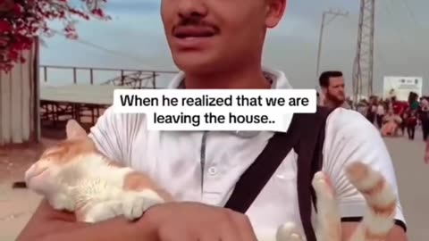 Palestinian Man Doesn’t Leave His Cat Behind