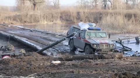 Russian combats crossed the Seversky Donets on a pontoon ferry.