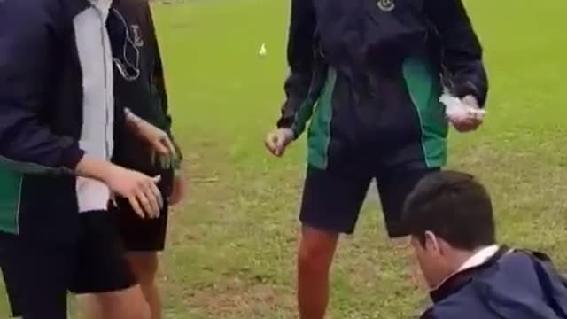 Blue shorts kid has traffic cone stepped on into crotch