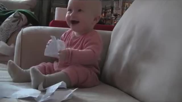 Baby laughing deadly at ripping of a paper